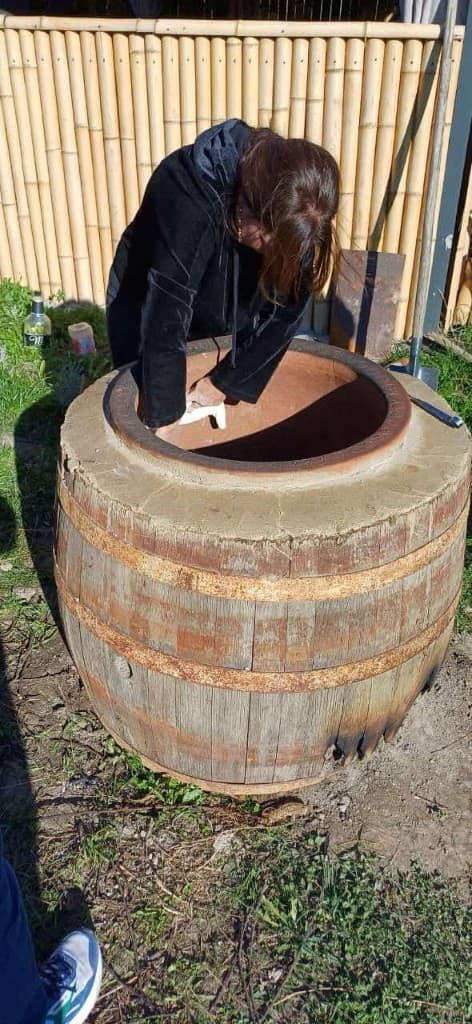 Artisan work on a clay-lined wooden barrel