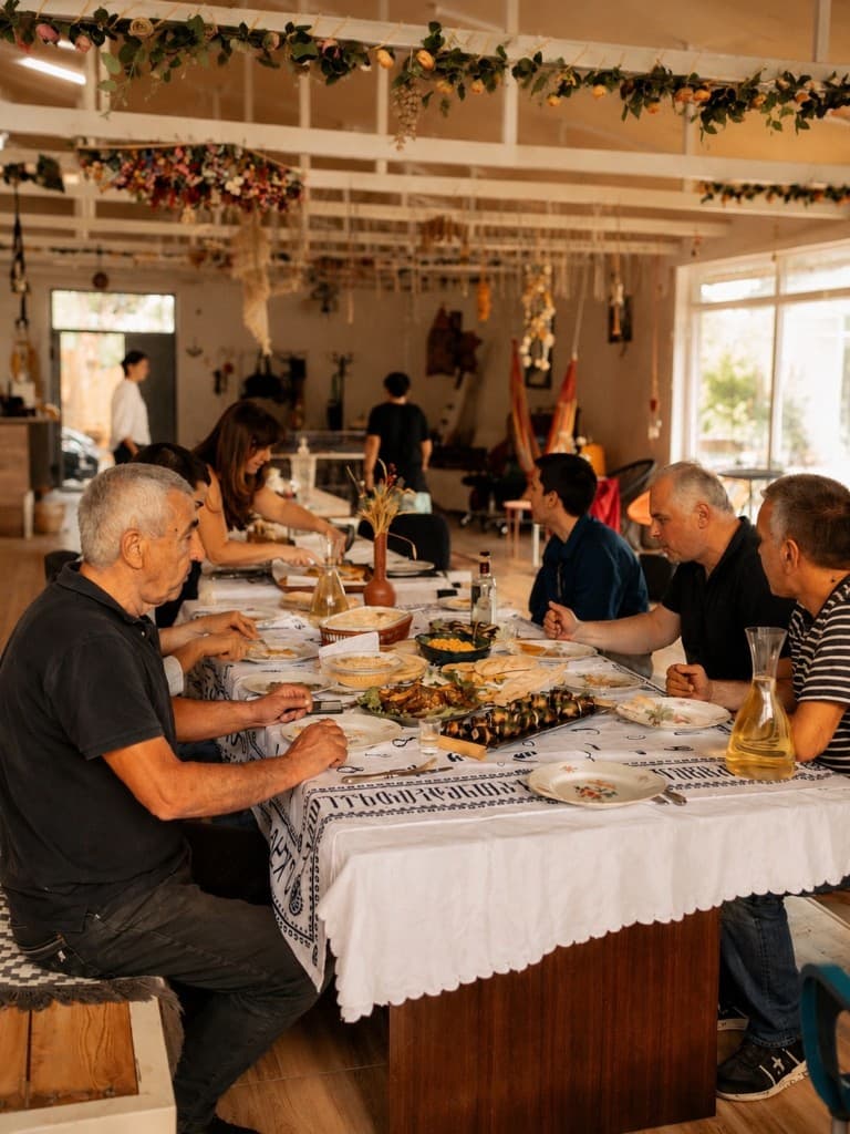 Georgian supra table with shared wine and dishes